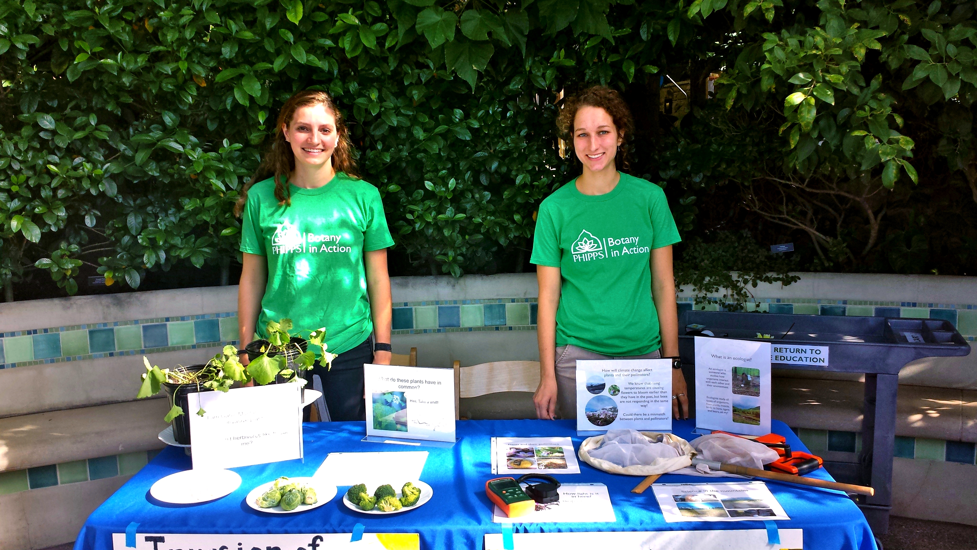 Morgan Roche (left) and Rebecca Dalton (right) tabling at an event in the Tropical Forest.