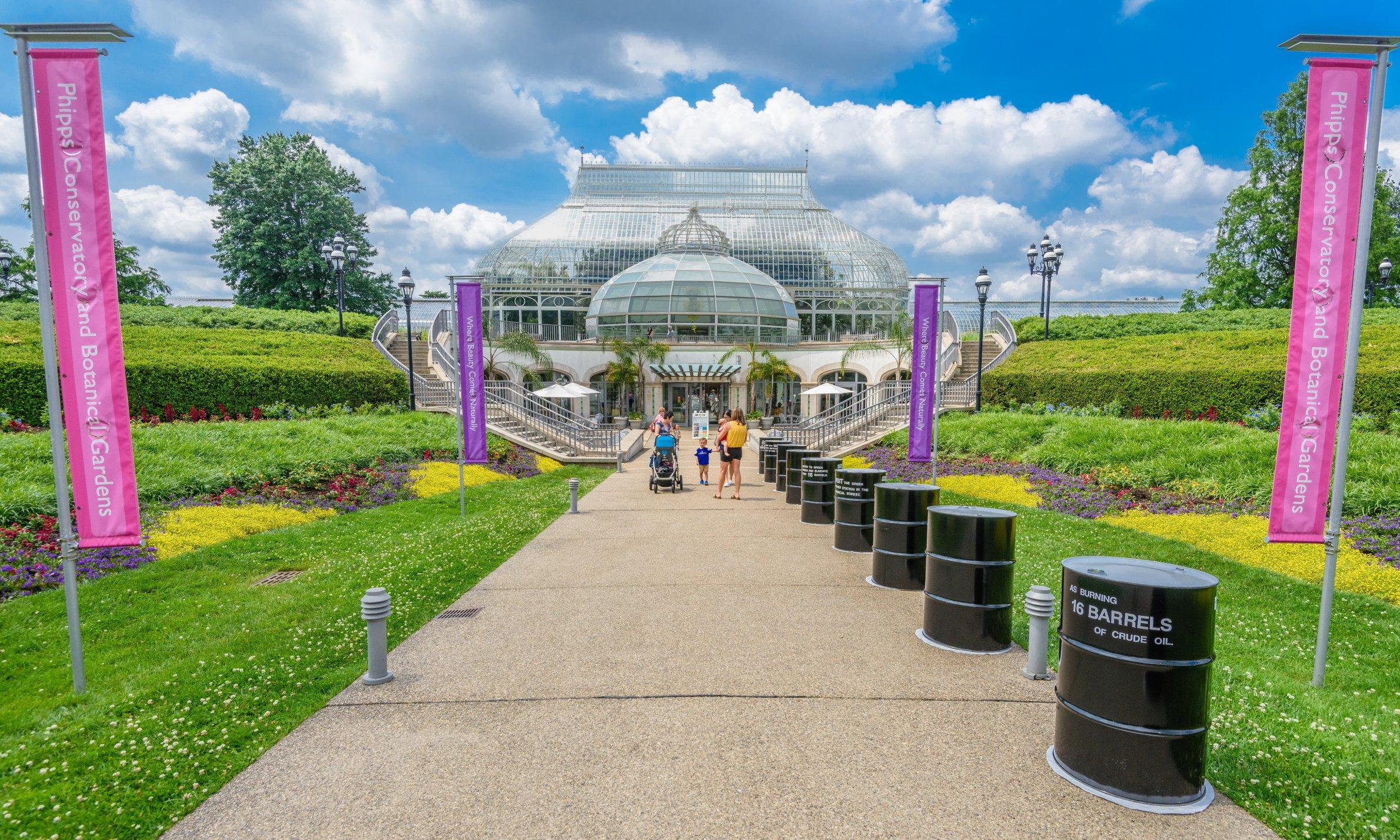 In a new display at Phipps' entrance, 16 oil barrels in a line show visitors the amount of CO2 they can prevent from being released into the atmosphere by switching to renewable energy.
