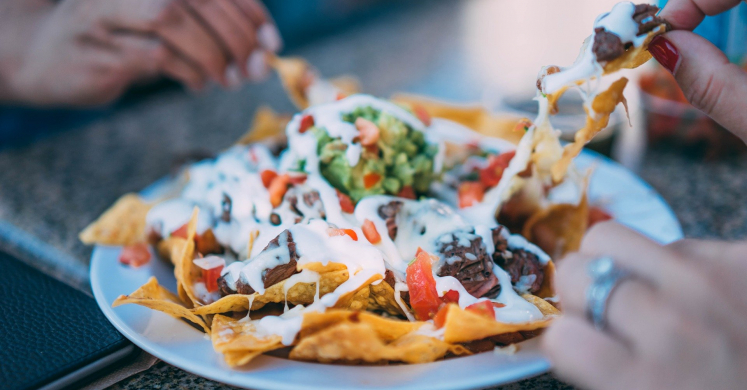 Veggie Stuffed Nachos with Cashew Queso and Green Sauce